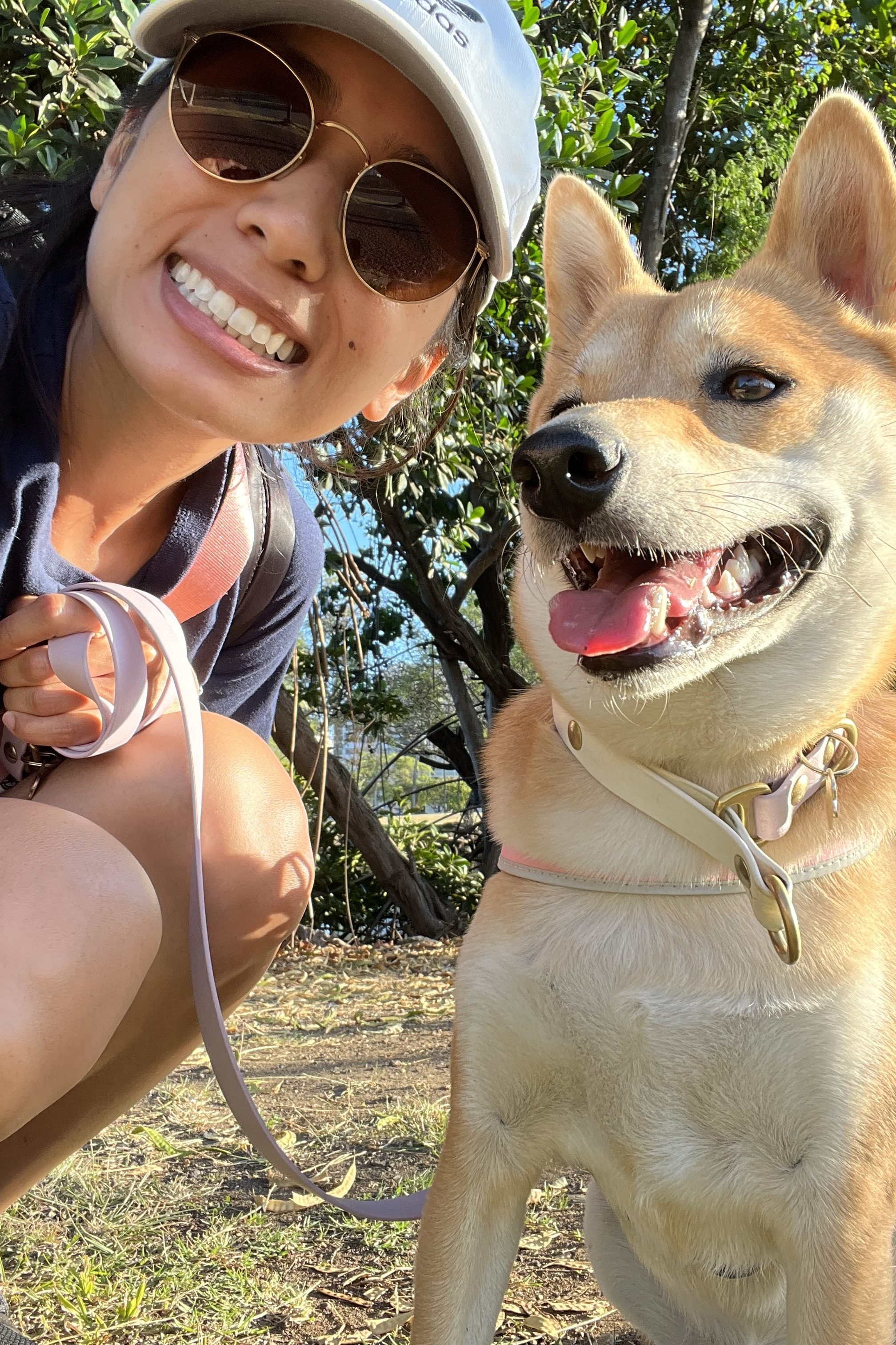 Saikaew Dudla and her dog, both smiling